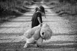 girl on path dragging stuffed animal
